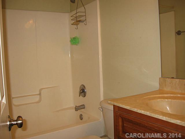 6028 Springhill Road, Unit 25 Stanfield, NC 28163 - Photo 9 of 15 a bathroom with a shower and a sink