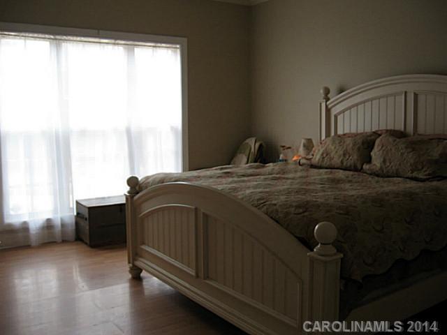 6028 Springhill Road, Unit 25 Stanfield, NC 28163 - Photo 10 of 15 a bedroom with a bed and window