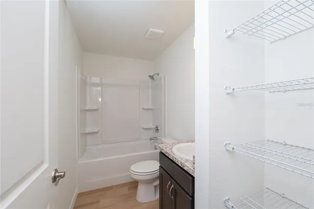 a view of an empty room and a window