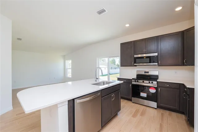 a large kitchen with stainless steel appliances