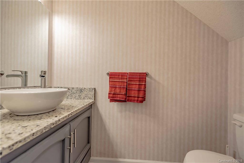 209 Eagle Road Belmont, NC 28012 - Photo 11 of 25 a bathroom with a granite countertop sink and a mirror