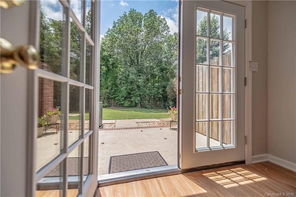 209 Eagle Road Belmont, NC 28012 - Photo 14 of 25 a view of a floor to ceiling window and a yard