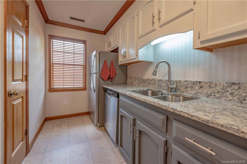 209 Eagle Road Belmont, NC 28012 - Photo 15 of 25 a kitchen with a sink and cabinets