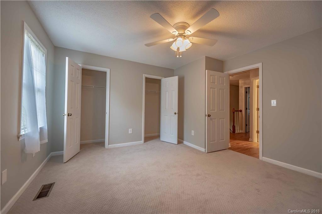 209 Eagle Road Belmont, NC 28012 - Photo 21 of 25 a view of an empty room with a chandelier fan