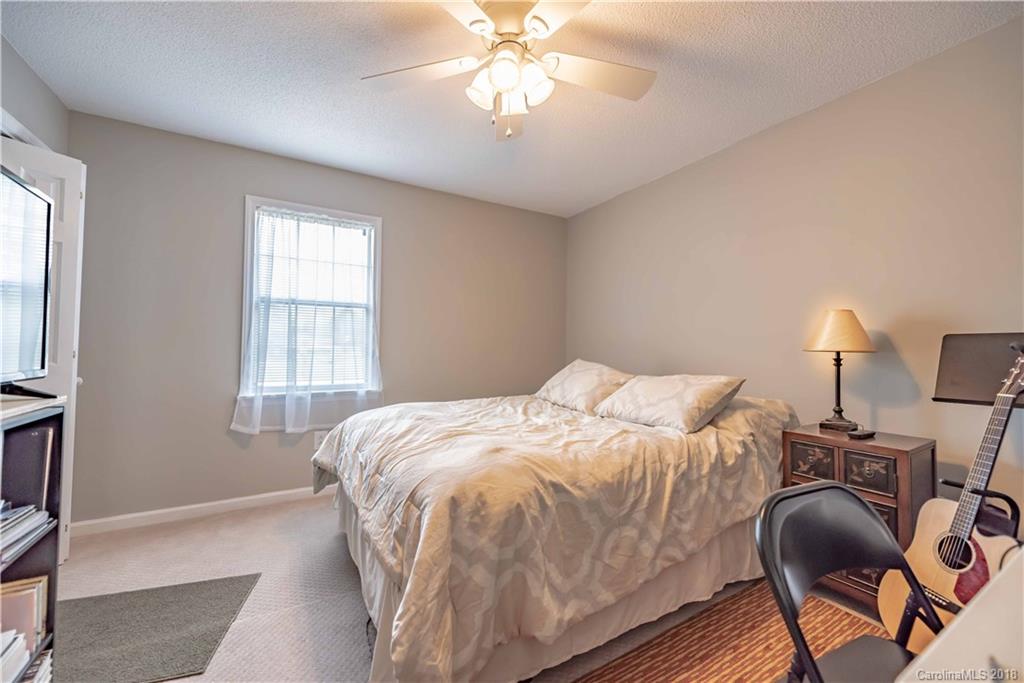 209 Eagle Road Belmont, NC 28012 - Photo 23 of 25 a bed sitting in a bedroom next to a window