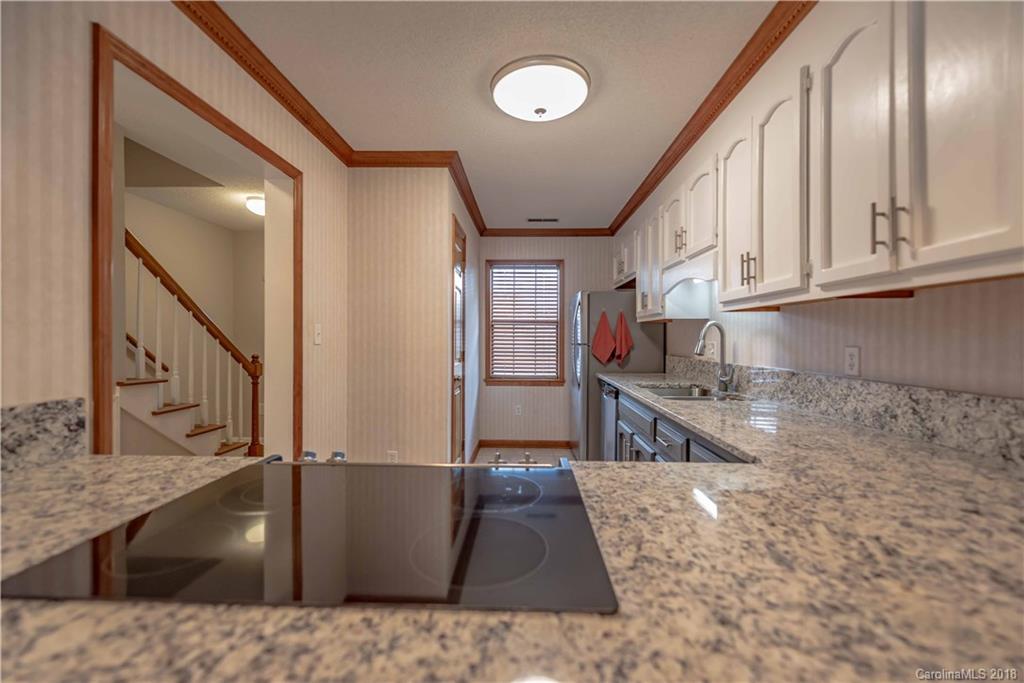 209 Eagle Road Belmont, NC 28012 - Photo 8 of 25 a kitchen with stainless steel appliances granite countertop a sink stove and cabinets