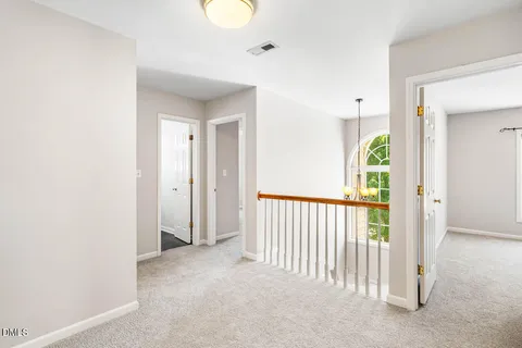 a view of a hallway with entryway door