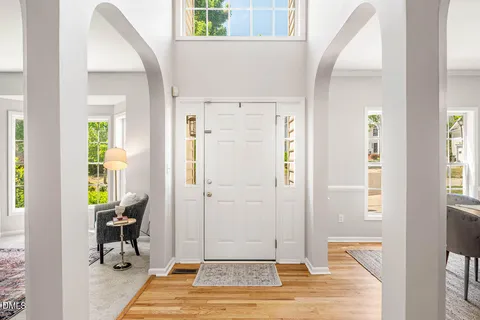 a view of a livingroom with wooden floor and a window