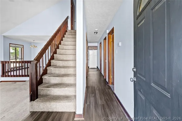 a view of staircase with wooden floor and staircase