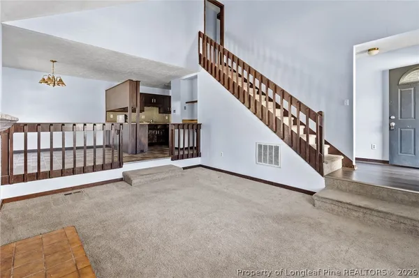 a view of staircase with lots of frames and stairs