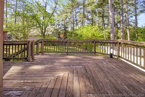 a view of balcony with wooden floor