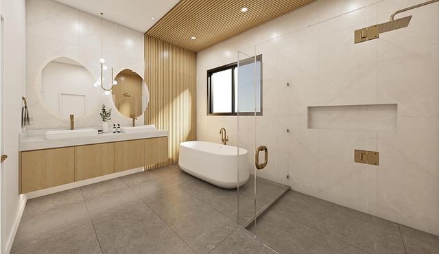 a en suite bathroom with a double vanity sink and a mirror