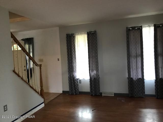 3504 Hill Run Road Effort, PA 18330 - Photo 13 of 22 an empty room with wooden floor and windows