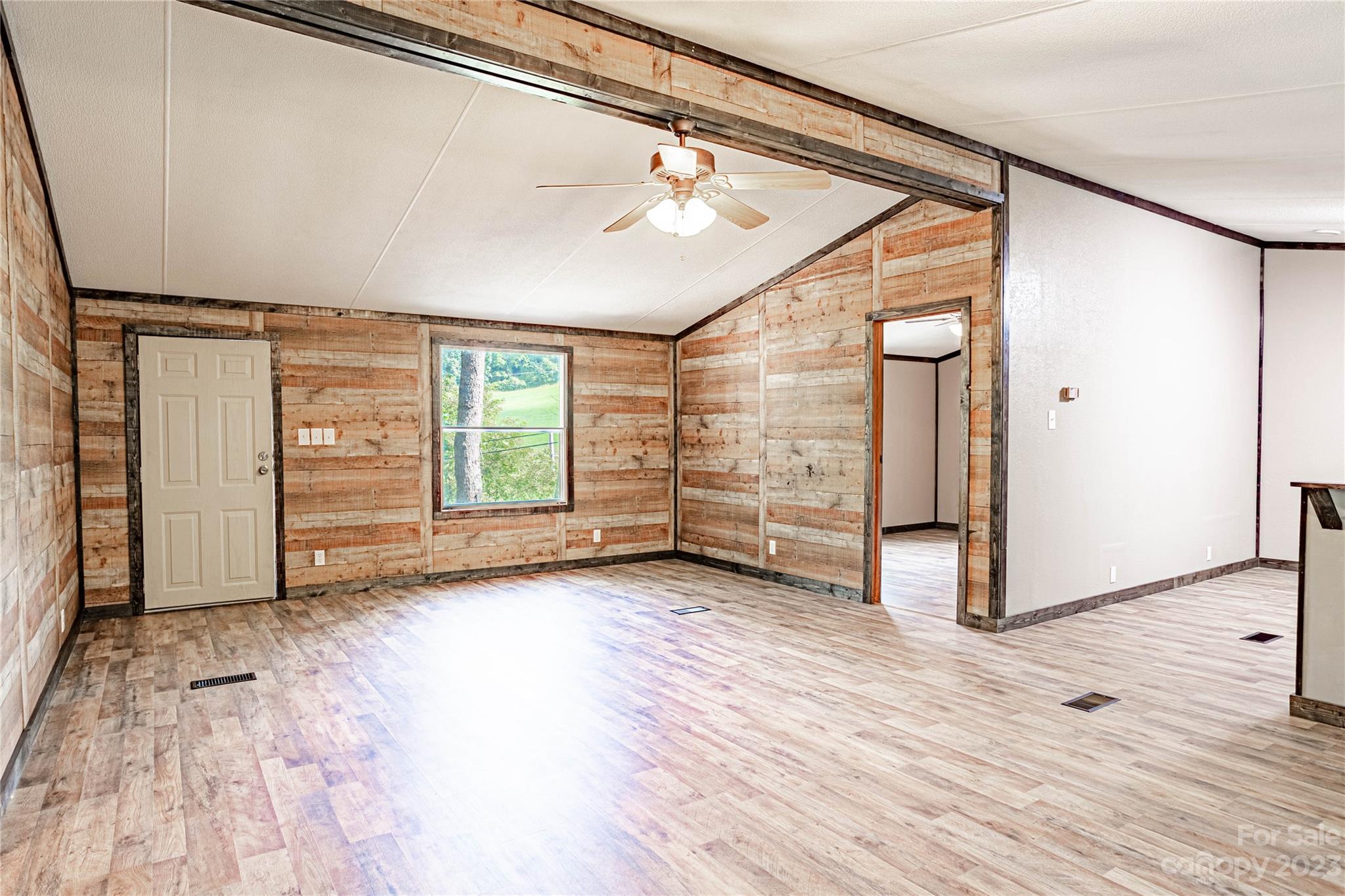 350 Sugar Cove Road Clyde, NC 28721 - Photo 4 of 20 a view of a room with wooden floor and window