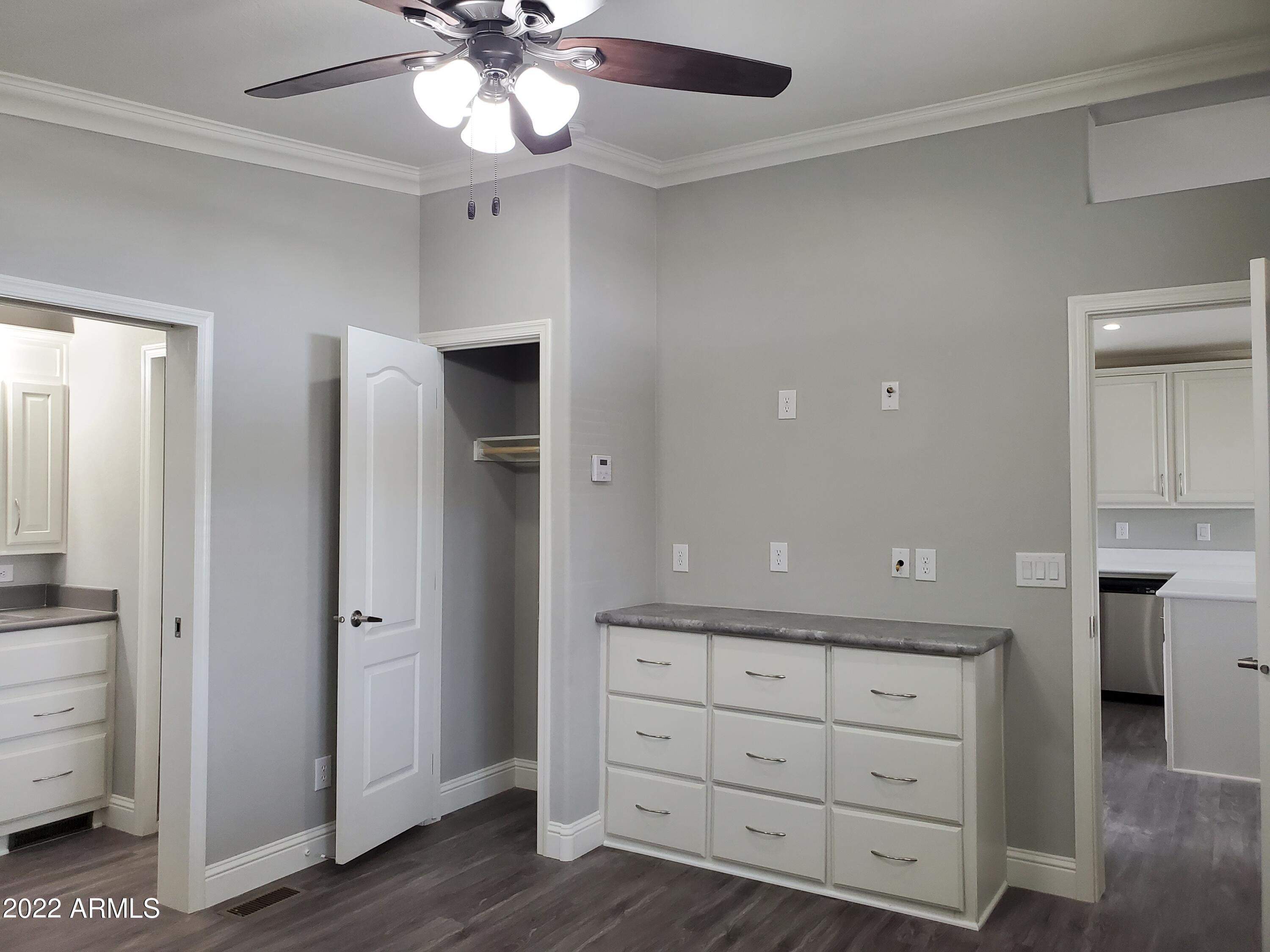 7750 East Broadway Road, Unit LOT 857 Mesa, AZ 85208 - Photo 14 of 17 a view of a hallway with closet and wooden floor