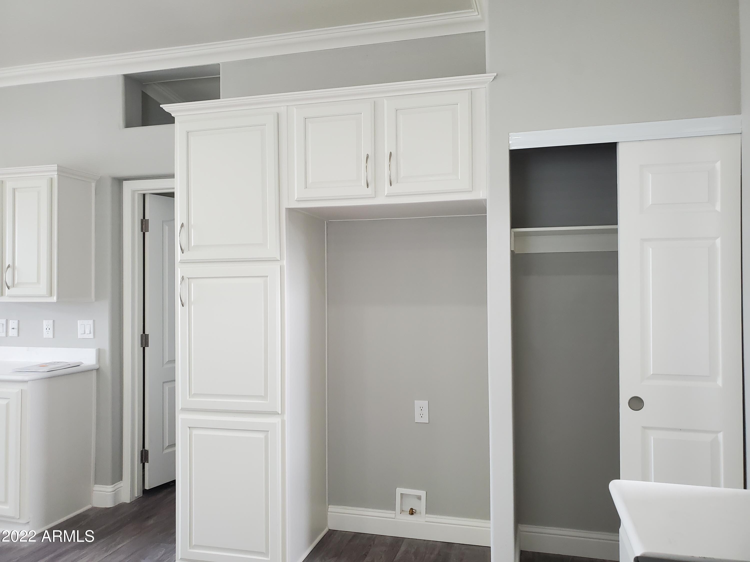 7750 East Broadway Road, Unit LOT 857 Mesa, AZ 85208 - Photo 17 of 17 a view of cabinets and bathroom with a sink
