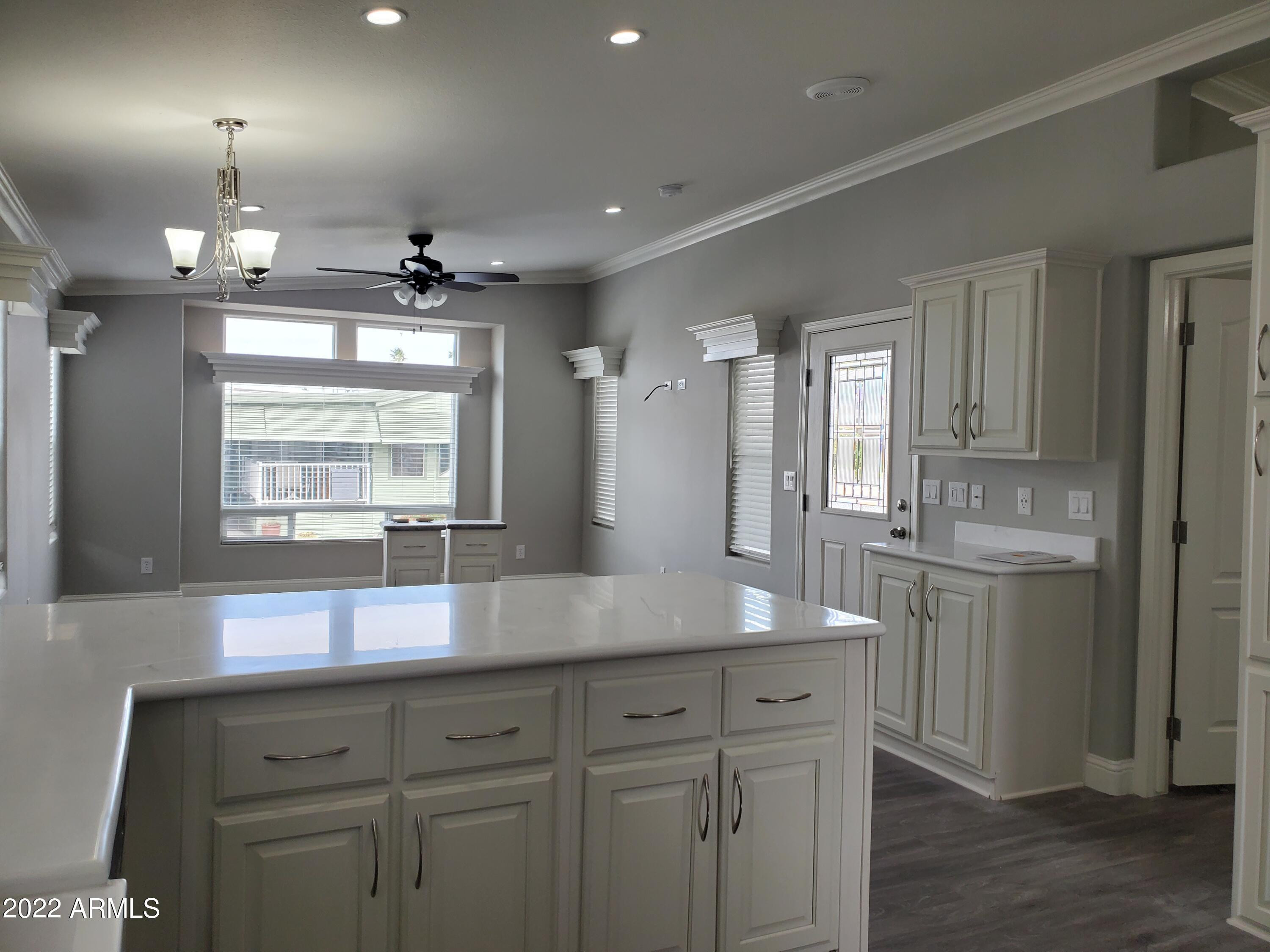 7750 East Broadway Road, Unit LOT 857 Mesa, AZ 85208 - Photo 3 of 17 a view of a granite countertop cabinets