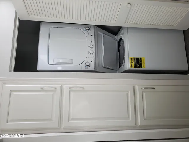 a bathroom with a sink a mirror and cabinets