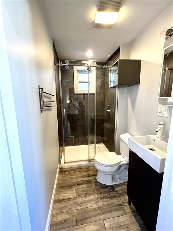 113 Moore Street, Unit 2 Boston, MA 02128 - Photo 12 of 19 a bathroom with a sink toilet and shower