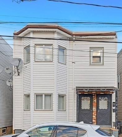 113 Moore Street, Unit 2 Boston, MA 02128 - Photo 2 of 19 a front view of a house
