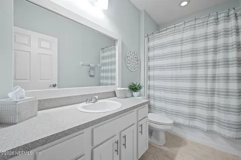 a balcony with furniture and a potted plant