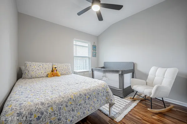 a view of a patio with table and chairs and potted plants