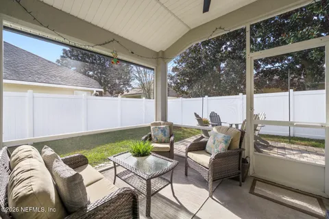 a view of a backyard with swimming pool