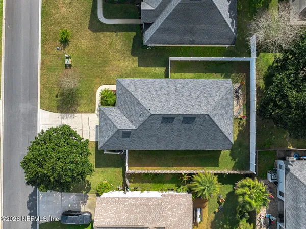 an aerial view of a house with outdoor space