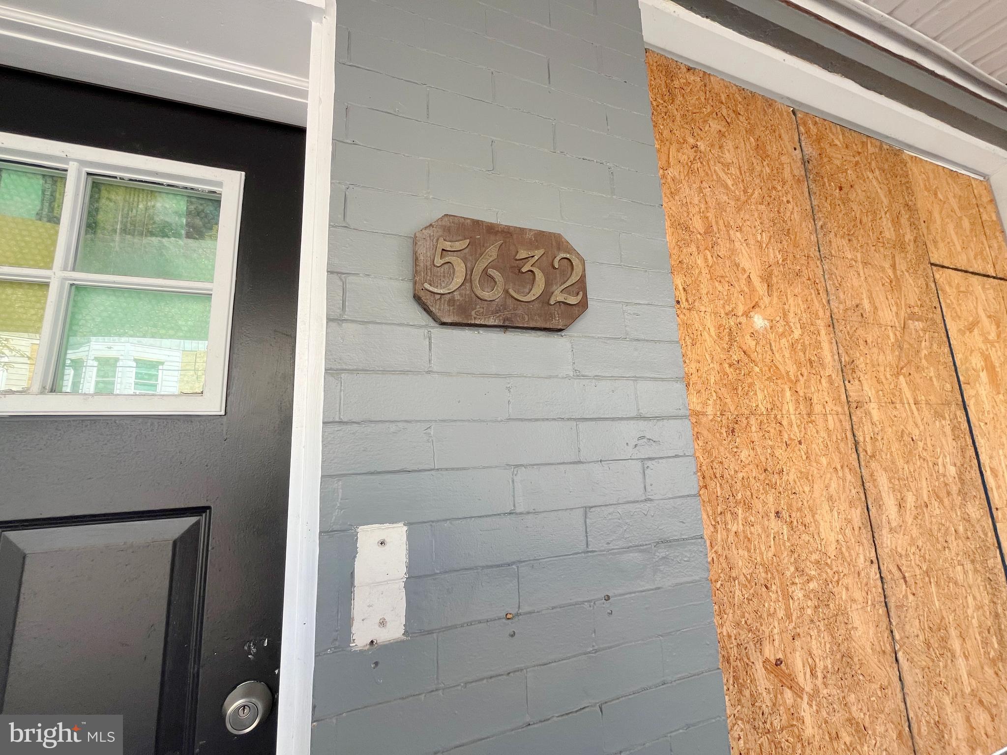 5632 Rodman Street Philadelphia, PA 19143 - Photo 6 of 8 a bathroom with a window and a shower