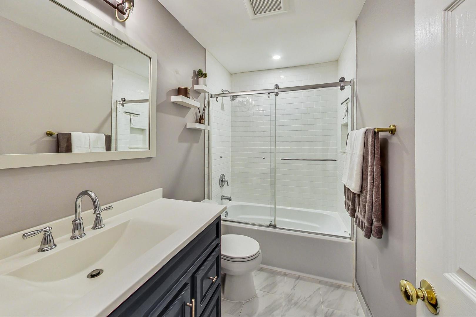 820 Sunset Road Wheaton, IL 60189 - Photo 16 of 32 a bathroom with a sink toilet and shower