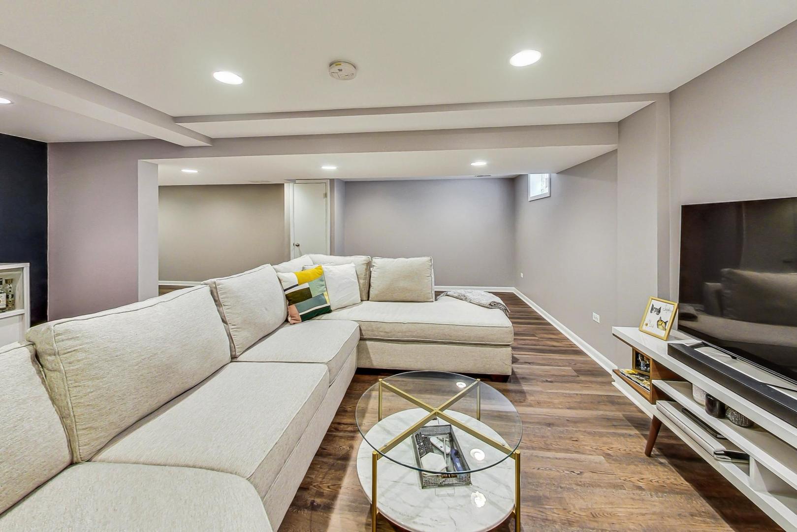 820 Sunset Road Wheaton, IL 60189 - Photo 19 of 32 a living room with furniture and a flat screen tv