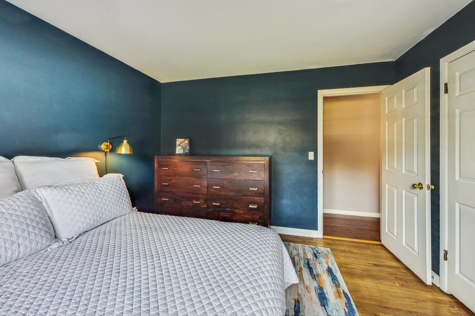 820 Sunset Road Wheaton, IL 60189 - Photo 10 of 32 a bedroom with a bed and wooden floor