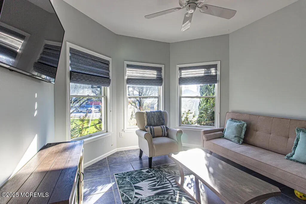 303 Highway 35, Unit 1 Point Pleasant Beach, NJ 08742 - Photo 12 of 25 a living room with furniture and a window