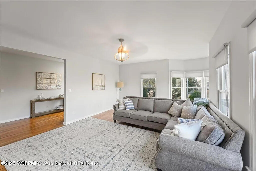 303 Highway 35, Unit 1 Point Pleasant Beach, NJ 08742 - Photo 15 of 25 a living room with furniture and a window