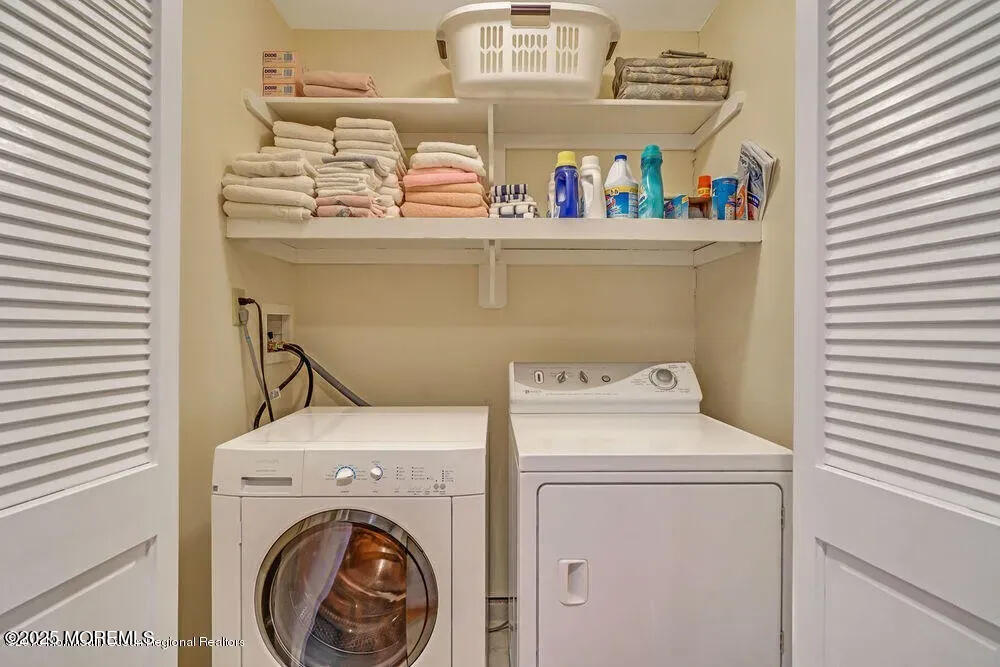 303 Highway 35, Unit 1 Point Pleasant Beach, NJ 08742 - Photo 18 of 25 a utility room with dryer and washer