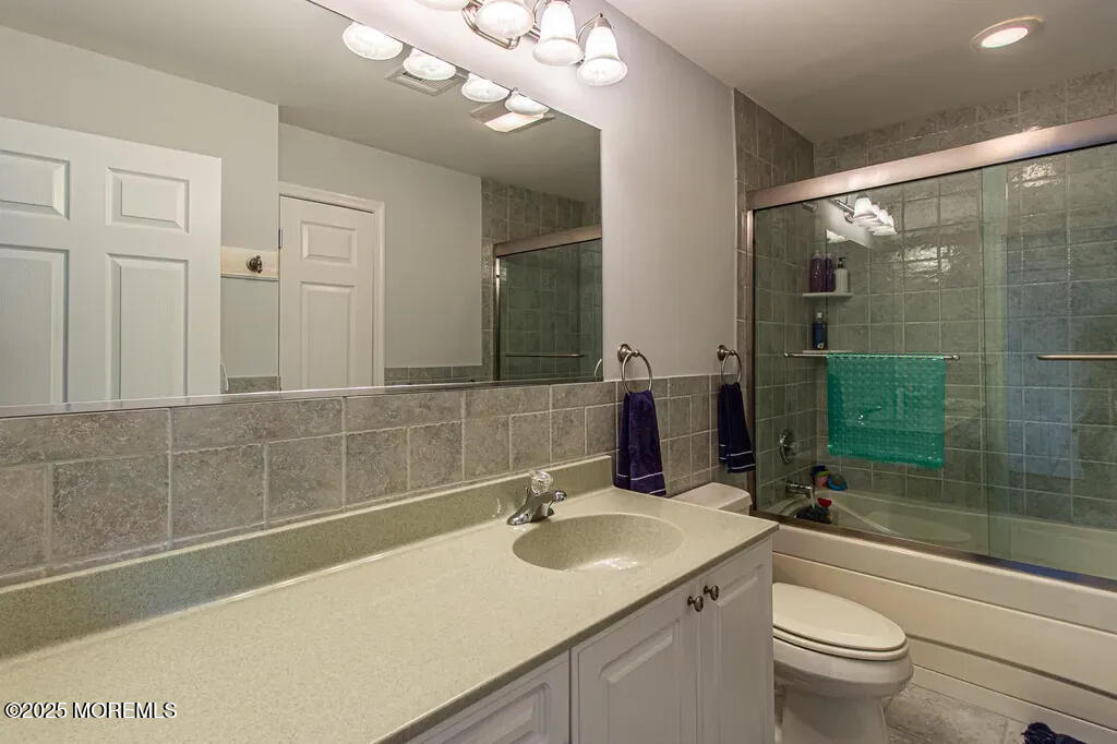 303 Highway 35, Unit 1 Point Pleasant Beach, NJ 08742 - Photo 22 of 25 a bathroom with a sink a toilet and shower