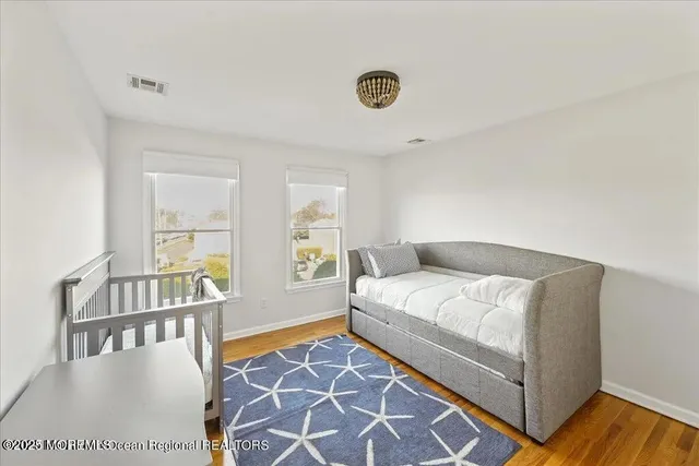 a bedroom with a bed and a table