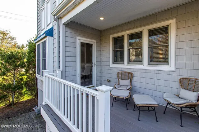 a front view of a house with outdoor seating