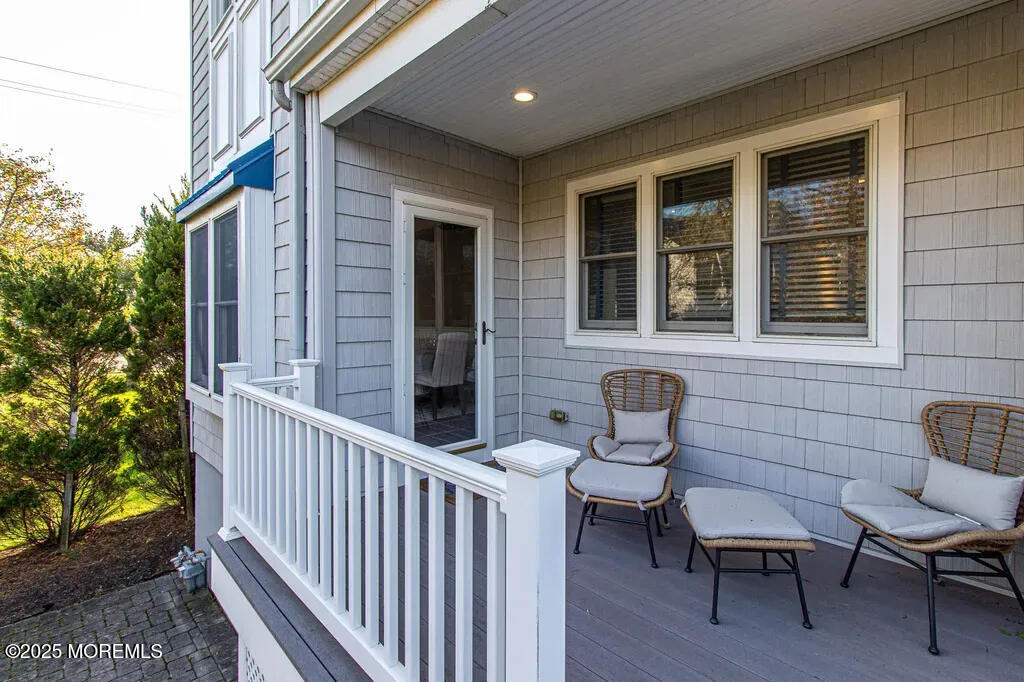 303 Highway 35, Unit 1 Point Pleasant Beach, NJ 08742 - Photo 4 of 25 a front view of a house with outdoor seating