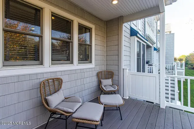 a view of a balcony with chair and table
