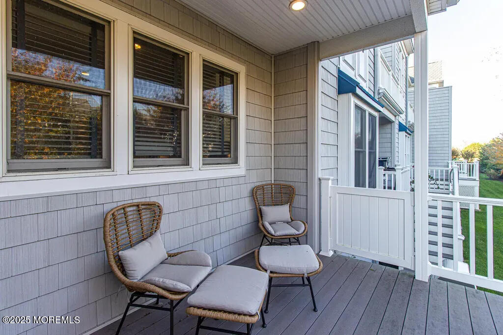 303 Highway 35, Unit 1 Point Pleasant Beach, NJ 08742 - Photo 5 of 25 a view of a balcony with chair and table