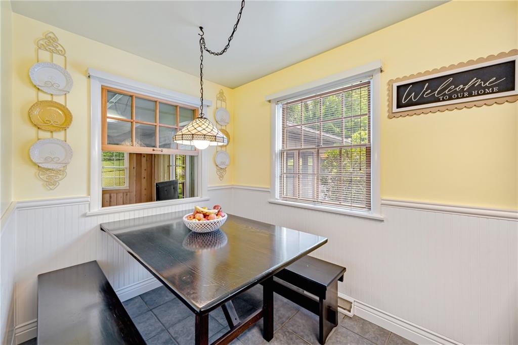 905 Lombard Street Irwin, PA 15642 - Photo 11 of 30 a view of a dining room with furniture window and outside view