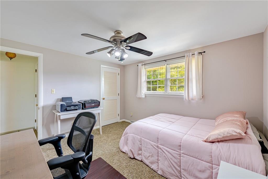 905 Lombard Street Irwin, PA 15642 - Photo 24 of 30 a bedroom with a bed and a window