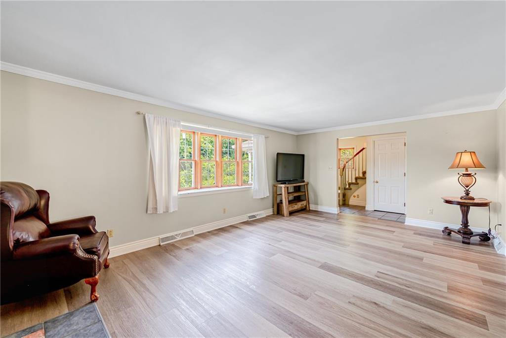 905 Lombard Street Irwin, PA 15642 - Photo 5 of 30 a view of a bedroom with furniture and a window