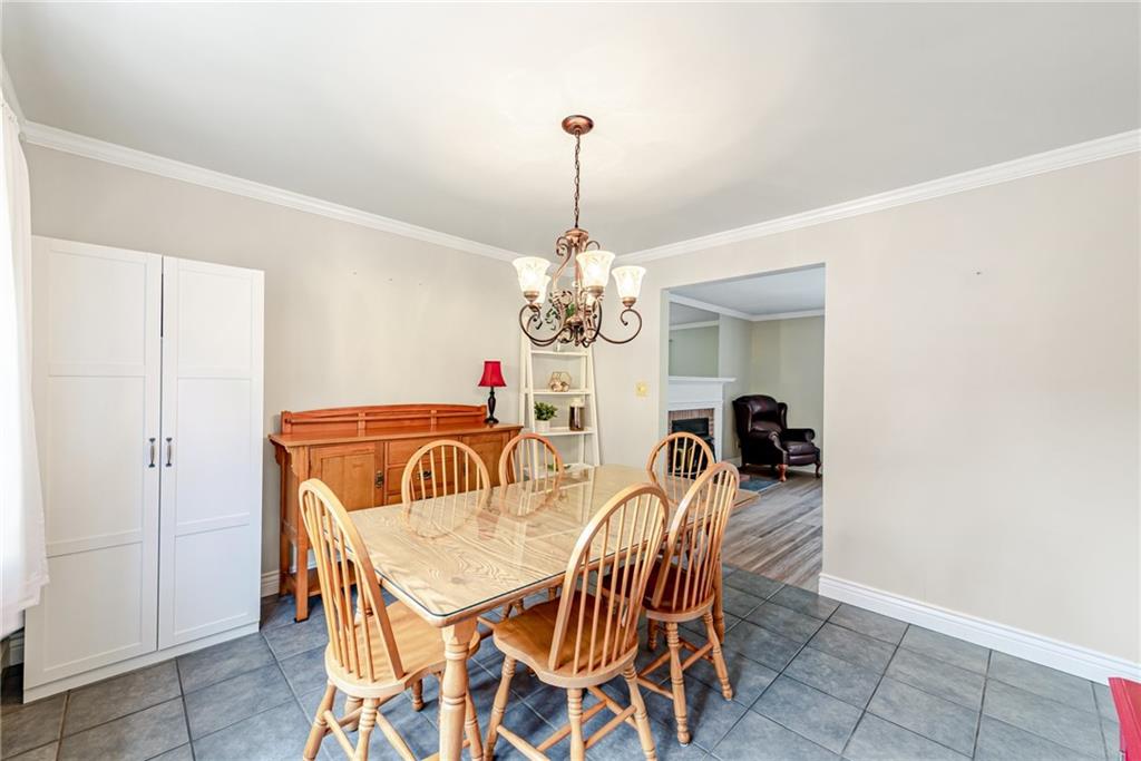 905 Lombard Street Irwin, PA 15642 - Photo 8 of 30 a view of a dining room with furniture and chandelier