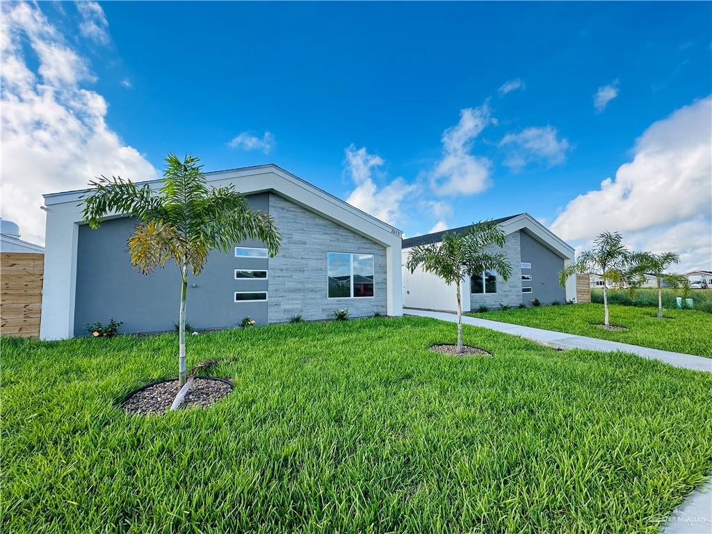 2613 Mockingbird Road, Unit C Weslaco, TX 78596 - Photo 1 of 1 a house view with a garden space