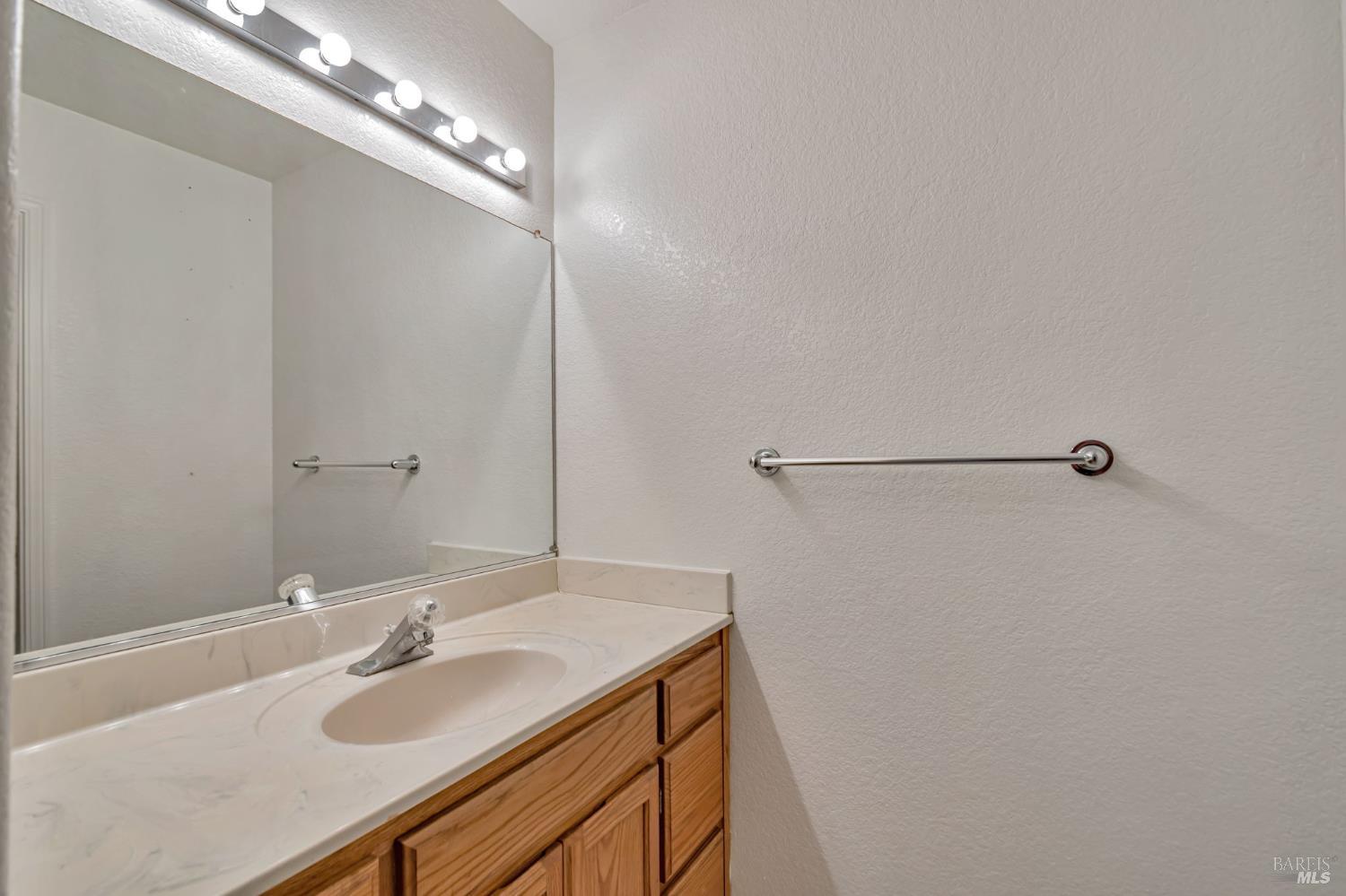 1239 Eardley Avenue Santa Rosa, CA 95401 - Photo 17 of 25 a bathroom with a sink and a mirror