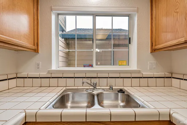 a kitchen with a sink and a window