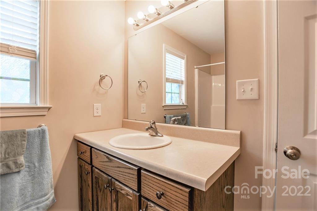 1577 State Rd S-46-323 York, SC 29745 - Photo 27 of 34 a bathroom with a sink vanity and a mirror