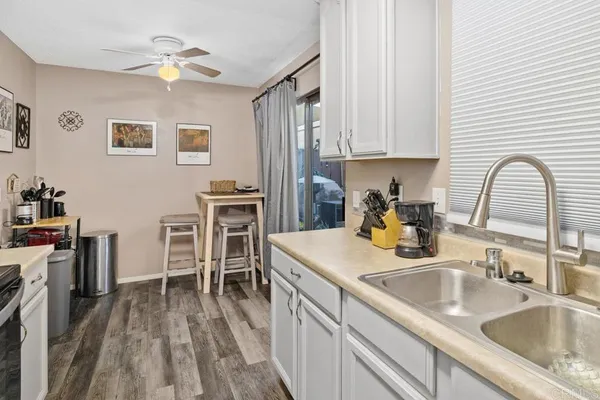 a kitchen with a sink cabinets and appliances